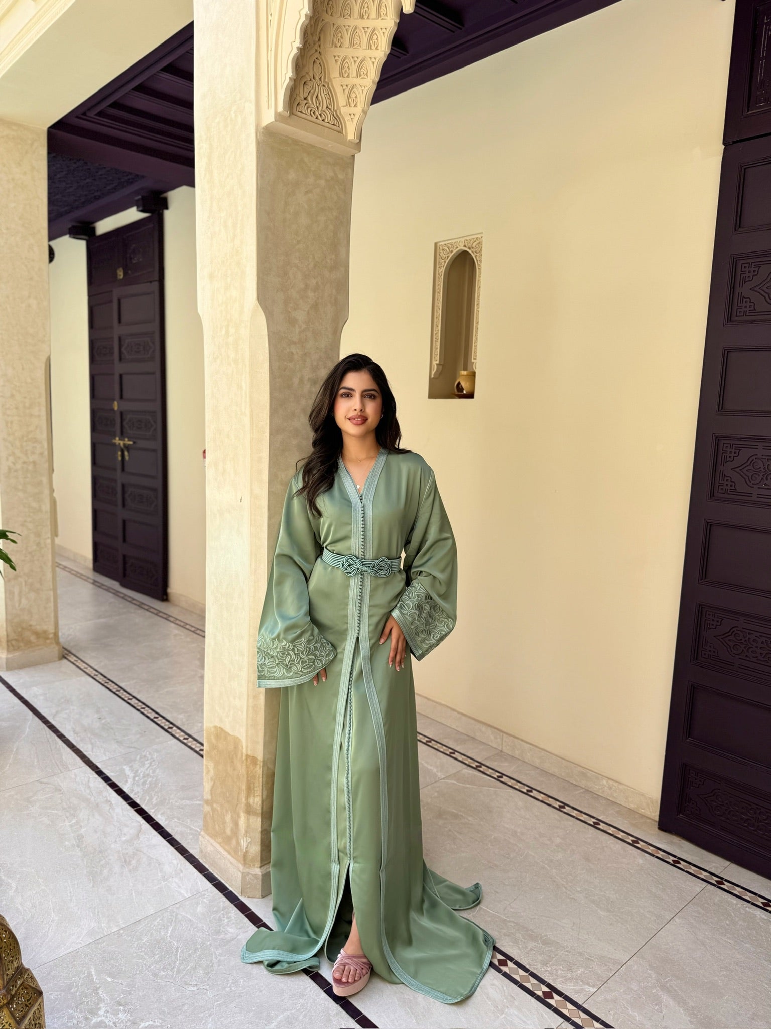Elegant sage green takchita styled for weddings and special occasions