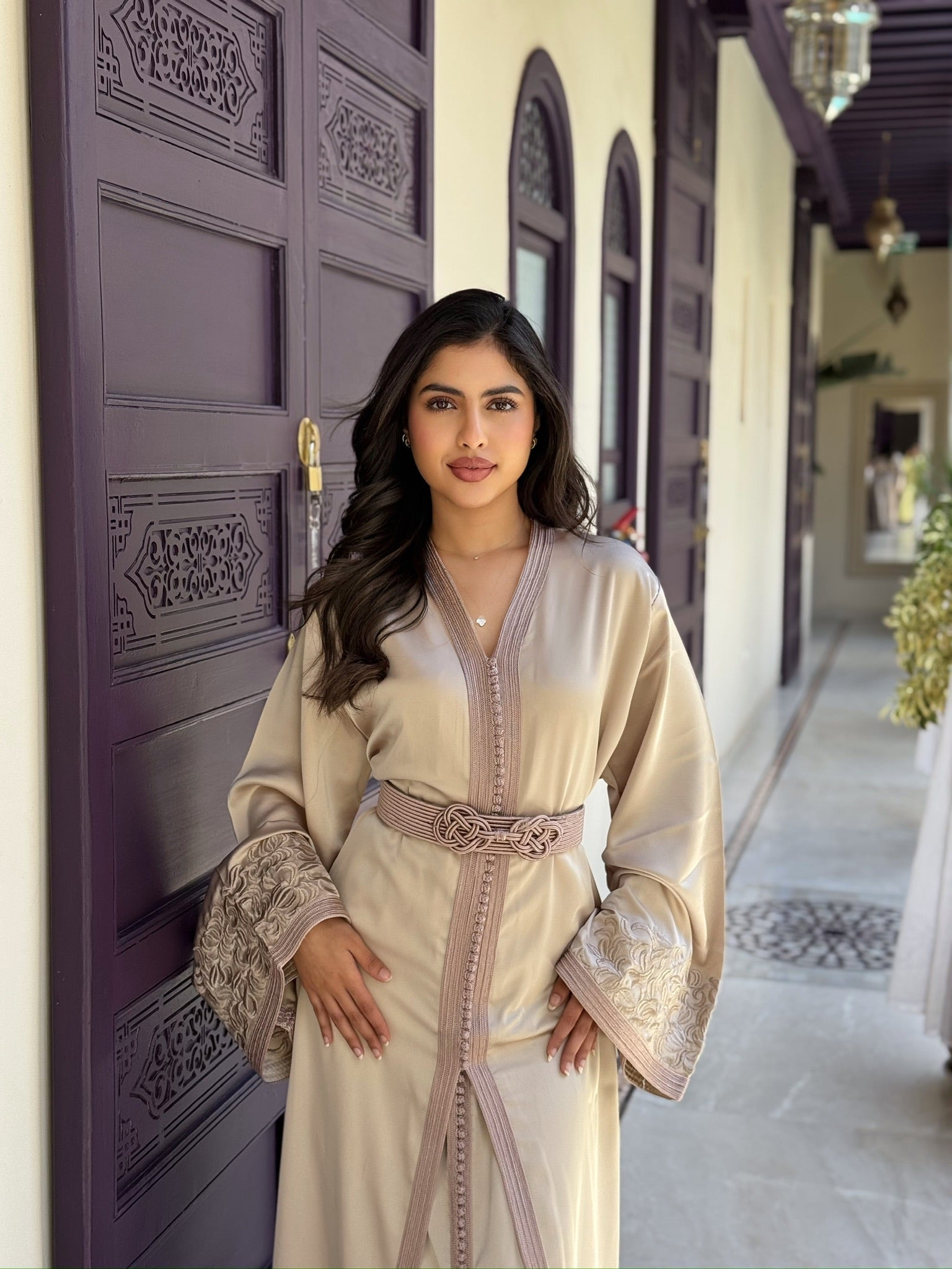 Elegant ivory takchita with a belted waist styled for weddings and special occasions
